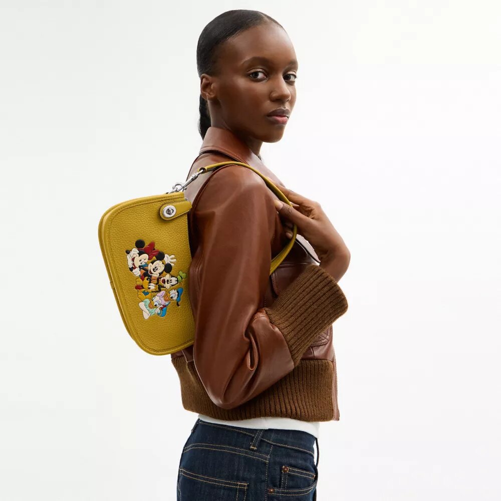 Disney X Coach Swinger Bag in Regenerative Leather with Mickey Mouse and Friends