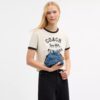Faye Mini Drawstring Bag in Signature Denim