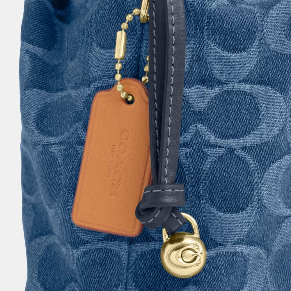Faye Mini Drawstring Bag in Signature Denim