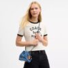 Faye Mini Drawstring Bag in Signature Denim