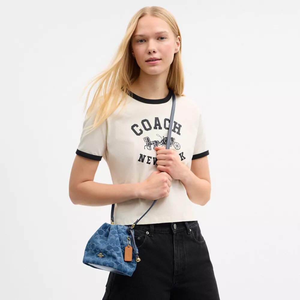 Faye Mini Drawstring Bag in Signature Denim