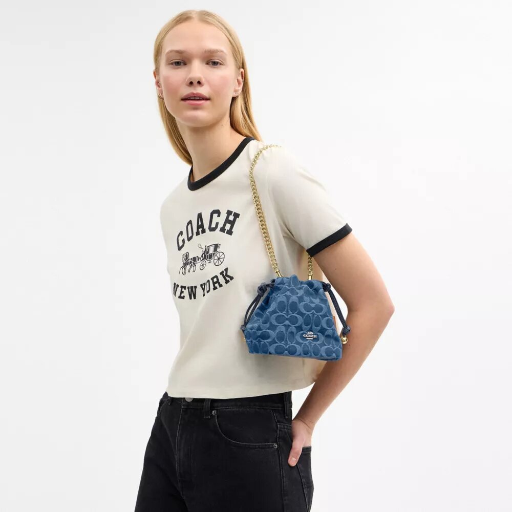 Faye Mini Drawstring Bag in Signature Denim