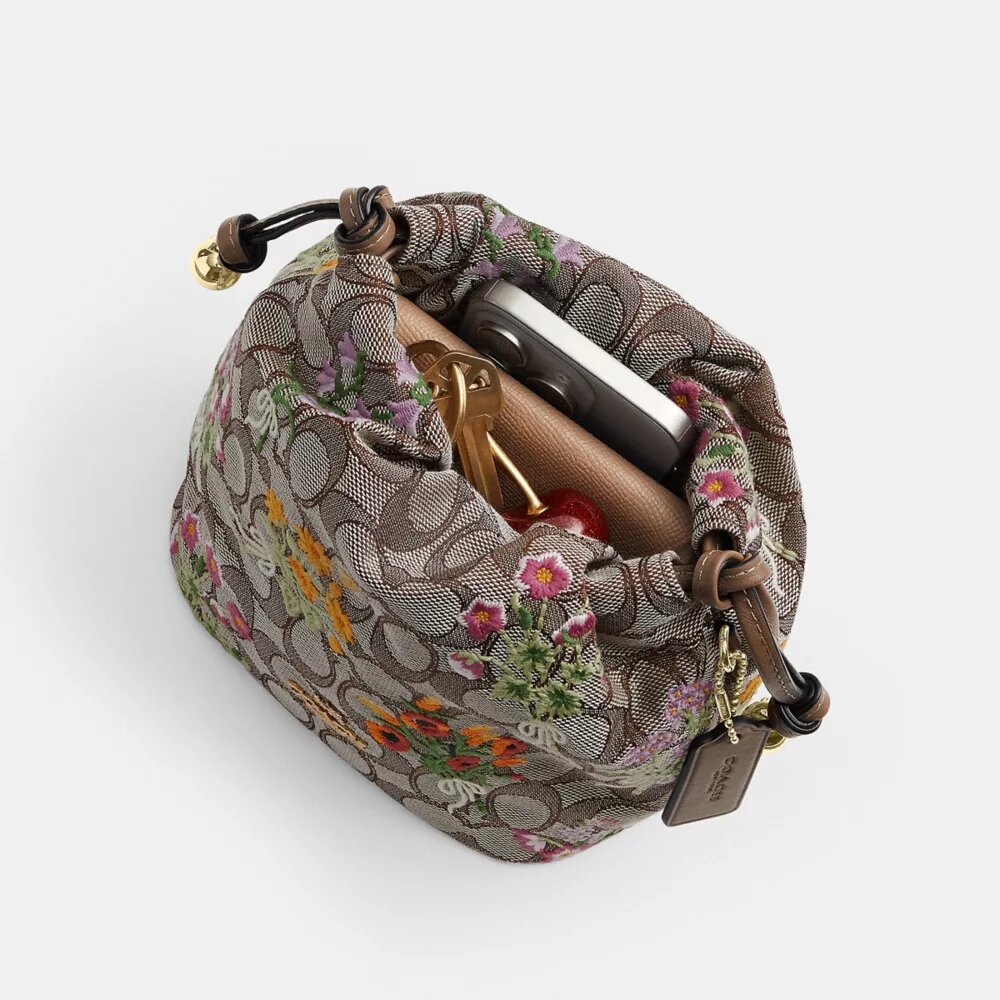 Faye Mini Drawstring Bag in Signature Jacquard with Floral Embroidery