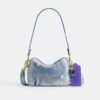 Mini Carey Crossbody Bag in Loved Denim with Charms