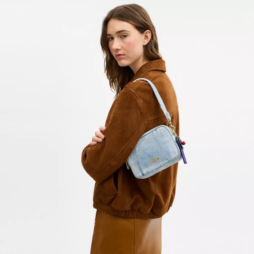Mini Carey Crossbody Bag in Loved Denim with Charms