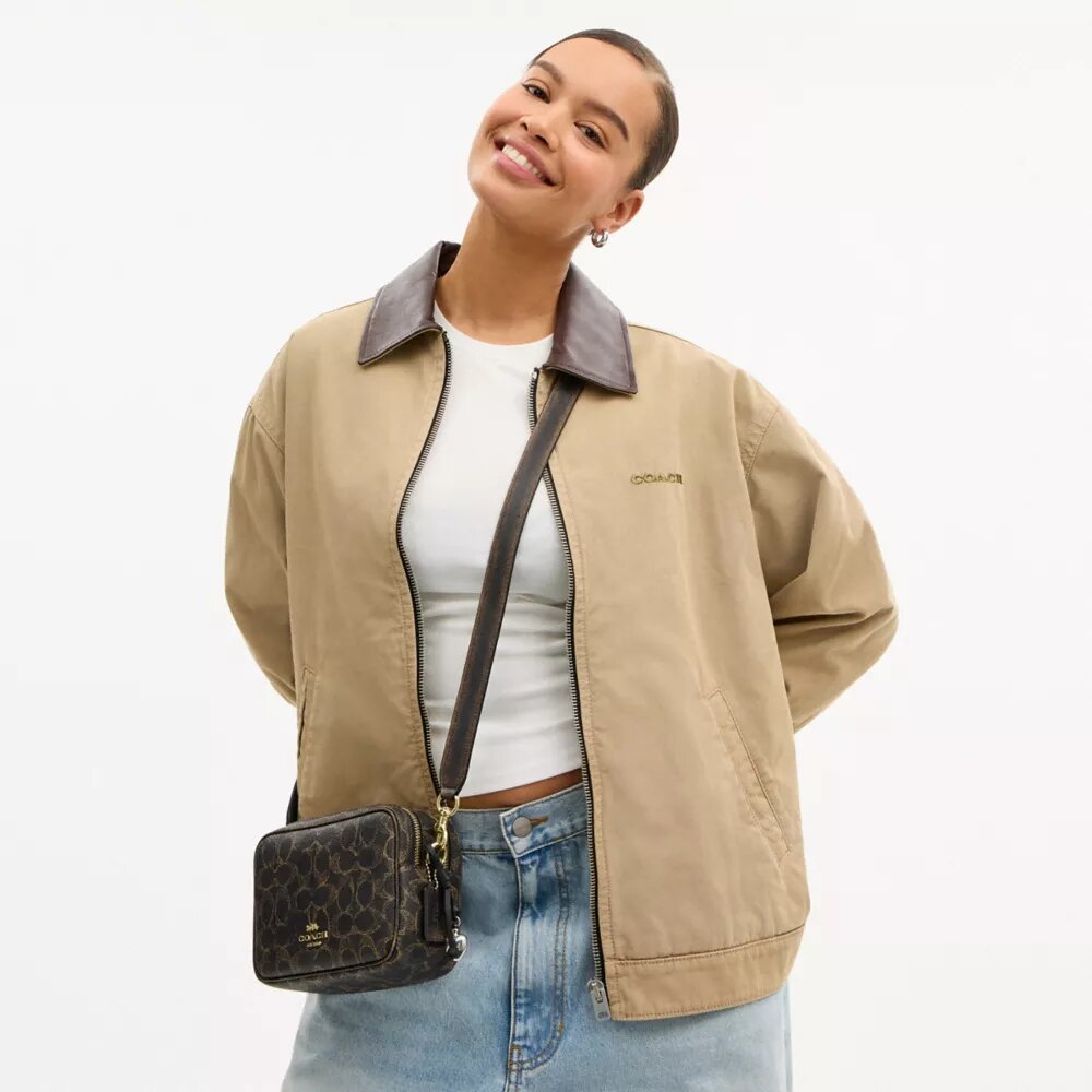 Mini Carey Crossbody Bag in Loved Signature Canvas
