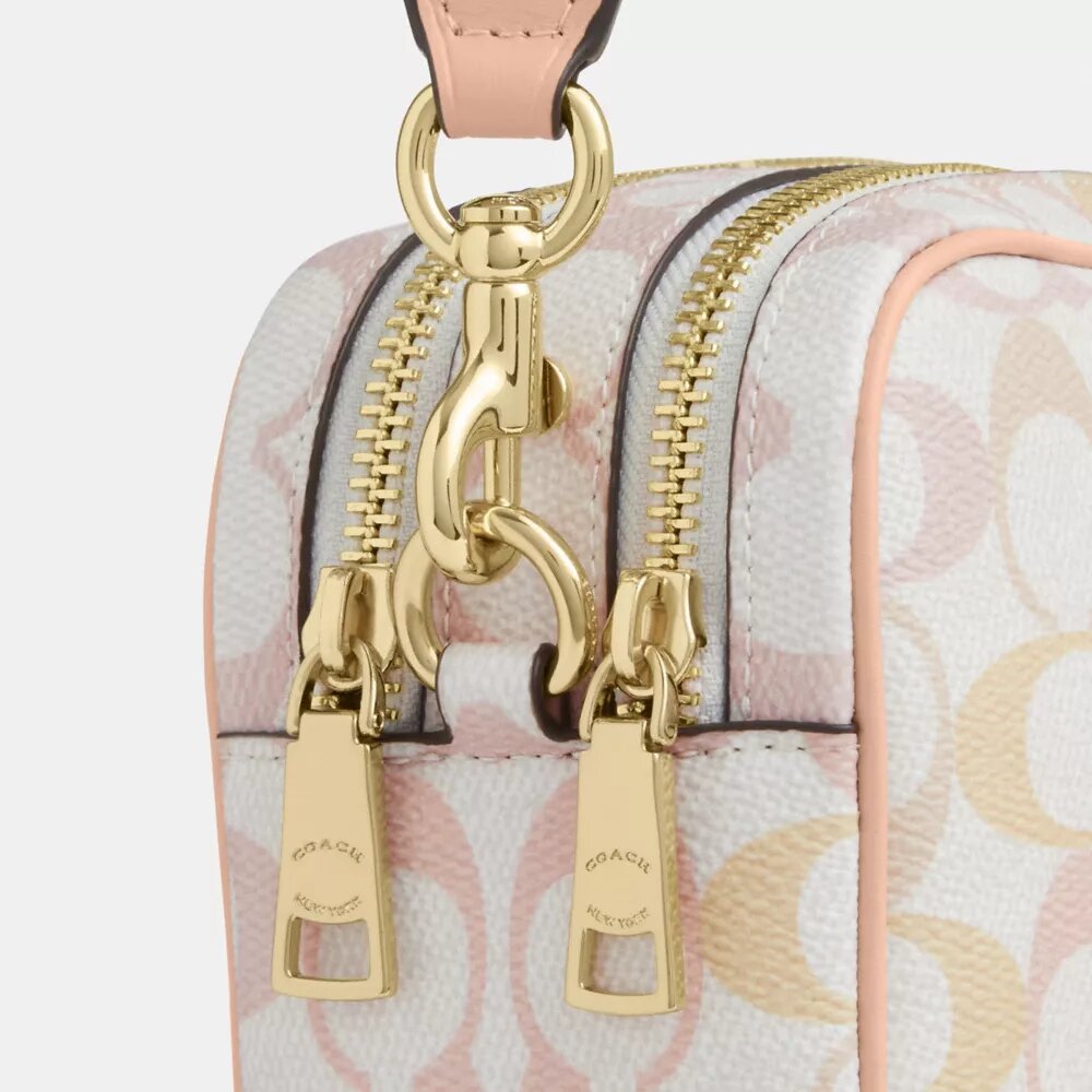 Mini Carey Crossbody Bag in Signature Canvas