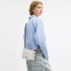 Mini Carey Crossbody Bag in Signature Canvas