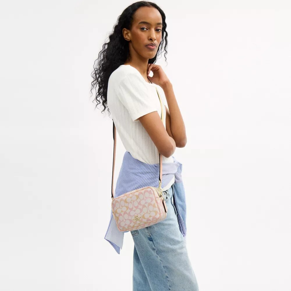 Mini Carey Crossbody Bag in Signature Canvas
