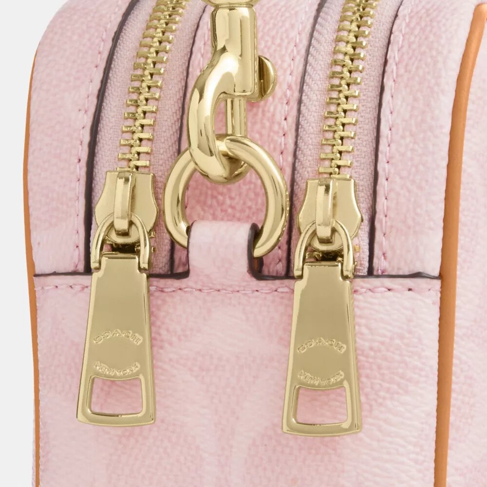 Mini Carey Crossbody Bag in Signature Canvas with Charms