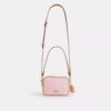 Mini Carey Crossbody Bag in Signature Canvas with Charms