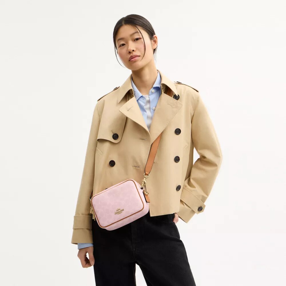 Mini Carey Crossbody Bag in Signature Canvas with Charms