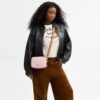 Mini Carey Crossbody Bag in Signature Canvas with Charms