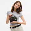 Mini Rowan Crossbody Bag in Loved Signature Canvas with Charms