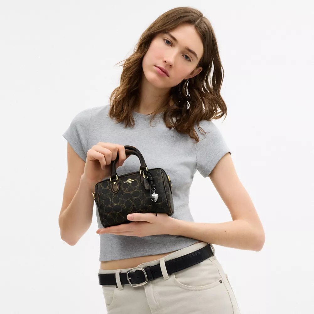 Mini Rowan Crossbody Bag in Loved Signature Canvas with Charms