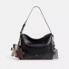 Mott Messenger Bag 38 in Loved Leather with Charms