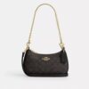 Teri Mini Crossbody Bag in Signature Canvas