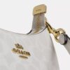 Teri Mini Crossbody Bag in Signature Canvas