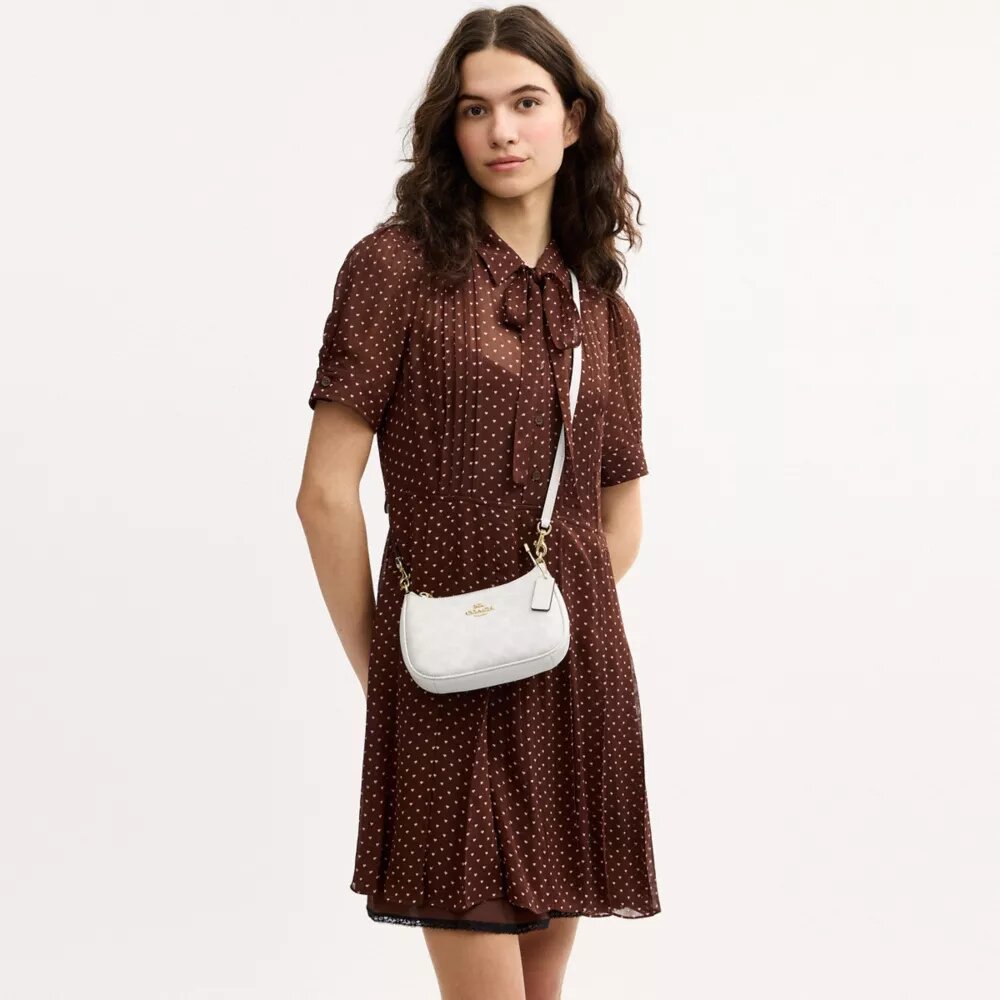 Teri Mini Crossbody Bag in Signature Canvas